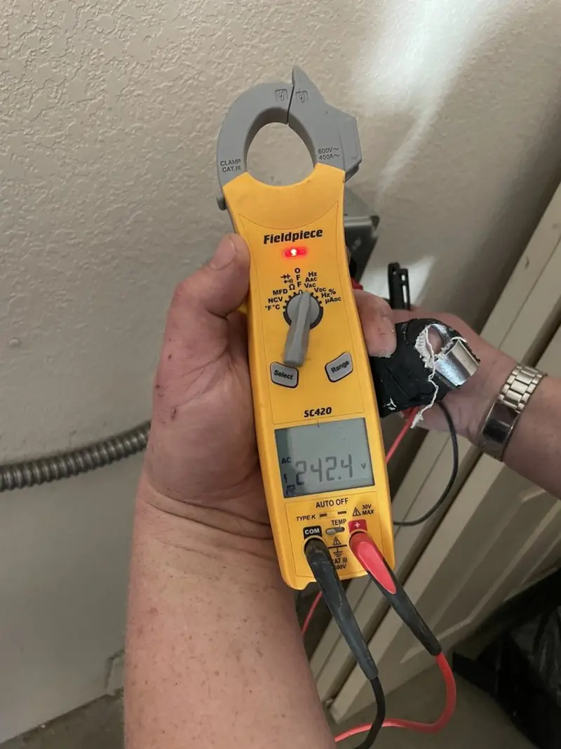 Voltage testing with clamp meter during Electrical Installation Services in West Laurel